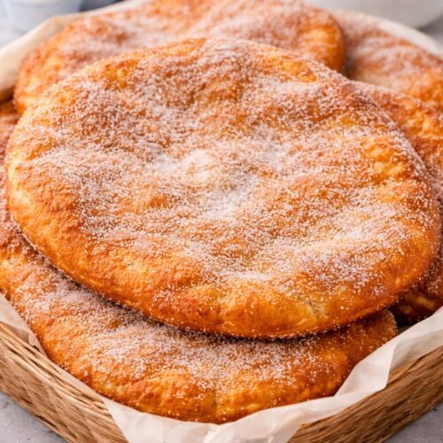 Fall River Portuguese donuts (malasadas) fried in large elephant ear style and rolled in sugar.