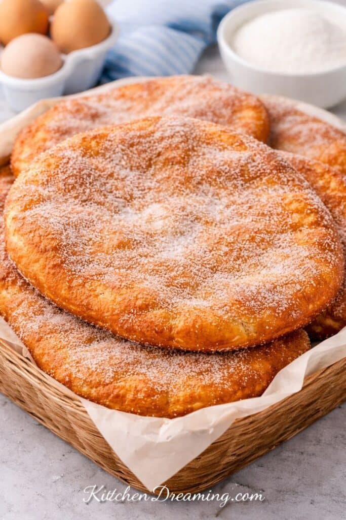Fall River Portuguese donuts (malasadas) fried in large elephant ear style and rolled in sugar.