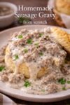 how to make sausage gravy from scratch (Easy Southern Recipe) 1 Close-up of homemade sausage gravy poured over a fluffy biscuit with visible sausage and black pepper.