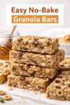 Stacked homemade no-bake granola bars made with peanut butter, honey, oats, cereal, and nuts, showing a chewy texture in an easy no-bake granola bar recipe.