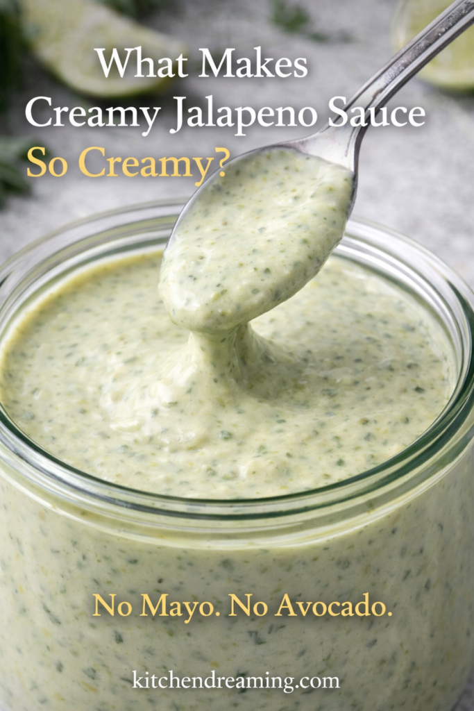 Creamy Jalapeno Sauce (Better Than Taco Bell) 10 Close-up of creamy jalapeno sauce being lifted with a spoon from a jar, showing thick emulsified texture in a homemade creamy jalapeno sauce recipe.