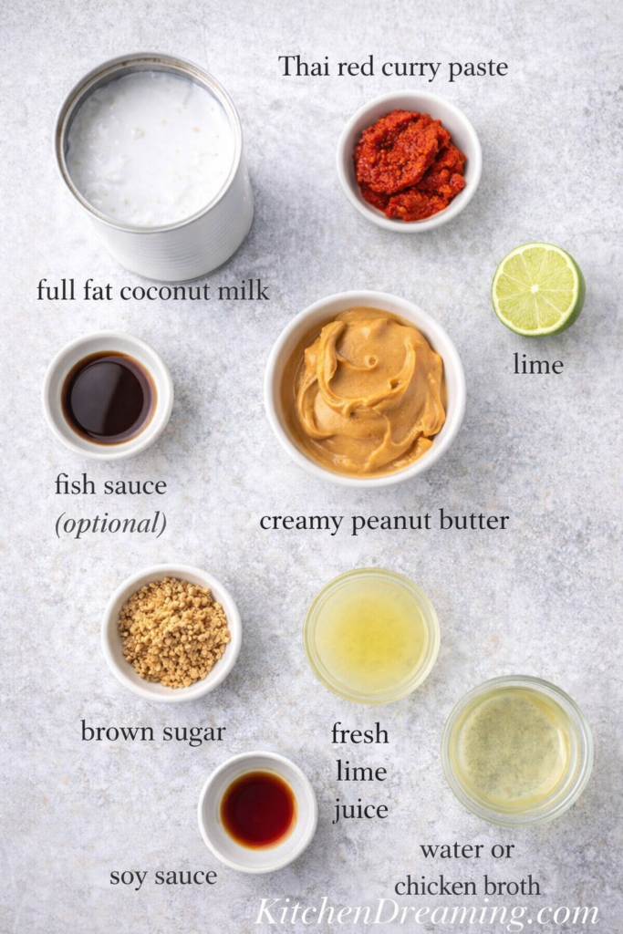 Pra Ram Sauce Recipe (Restaurant-Style Thai Peanut Curry) 3 Labeled ingredient flat lay for Pra Ram sauce recipe featuring coconut milk, red curry paste, peanut butter, soy sauce, sugar, lime juice, and broth.
