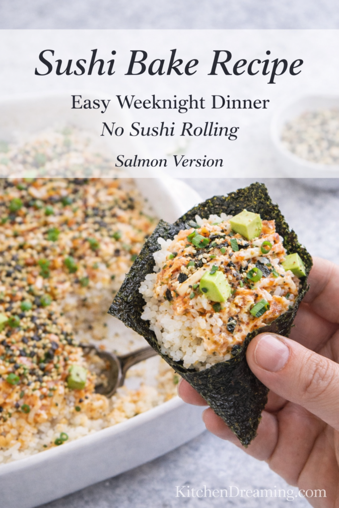 Salmon Sushi Bake Recipe (Easy, Creamy Sushi Bake) 8 Sushi bake recipe in casserole dish with salmon mixture and a nori bite held in hand.