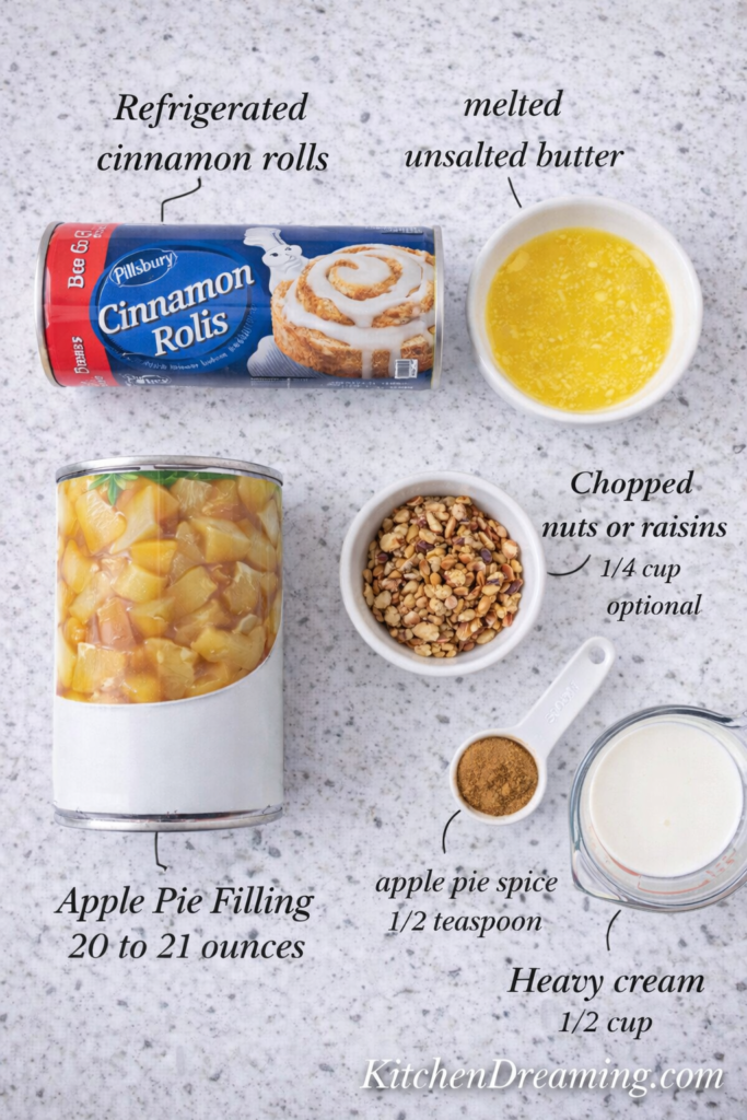 TikTok Cinnamon Roll Hack with Apple Pie Filling (Viral & Easy!) 3 Ingredient flat lay labeled for TikTok cinnamon roll hack recipe including canned cinnamon rolls, apple pie filling, melted butter, apple pie spice, heavy cream, and optional nuts.
