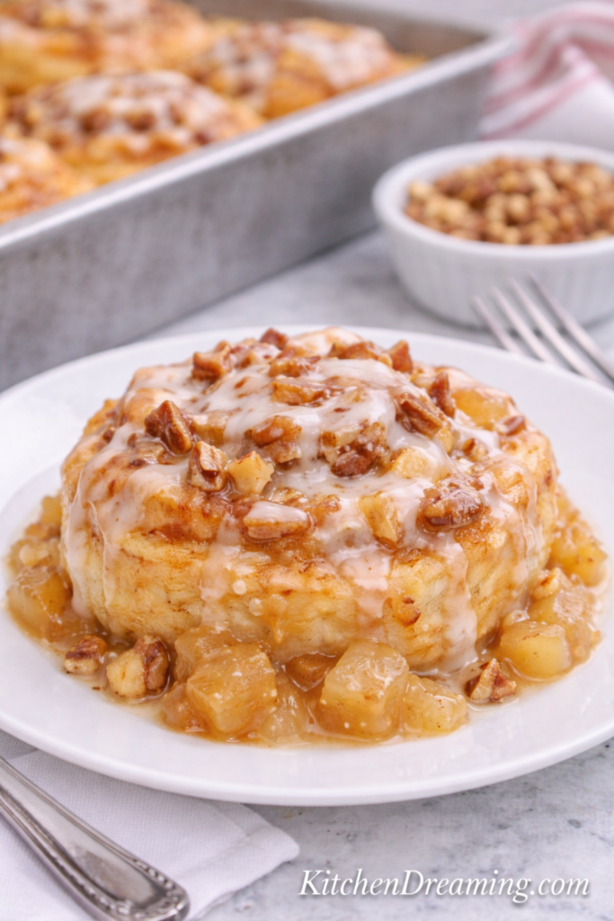 TikTok Cinnamon Roll Hack with Apple Pie Filling (Viral & Easy!) 4 Plated TikTok cinnamon roll hack with apple pie filling, icing, and optional nuts, showing gooey texture from heavy cream cinnamon roll hack method.