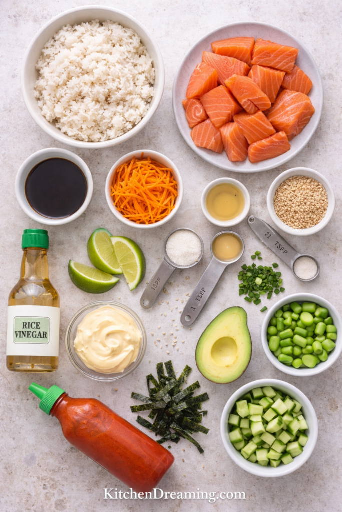 Salmon Sushi Bowl Recipe (Fresh Sushi Grade Salmon Bowl) 2 Salmon sushi bowl ingredients including salmon, rice, avocado, and cucumber.