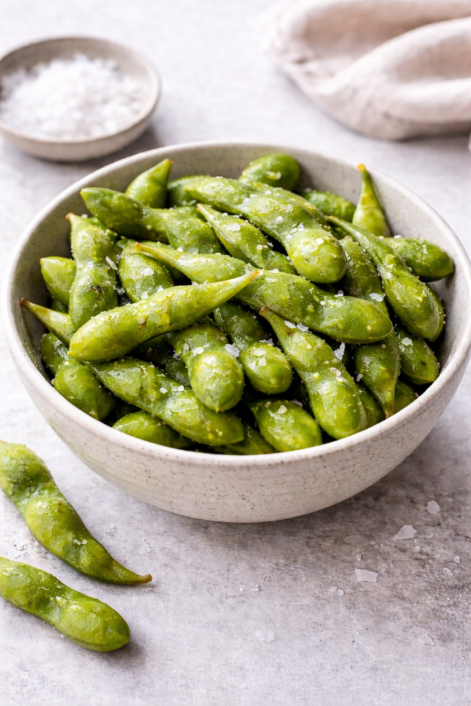 steamed edamame in bowl with sea salt easy healthy snack